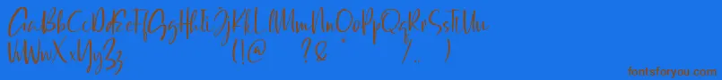 Qatar Capital Demo-Schriftart – Braune Schriften auf blauem Hintergrund