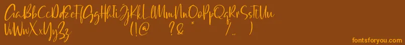 Qatar Capital Demo Font – Orange Fonts on Brown Background