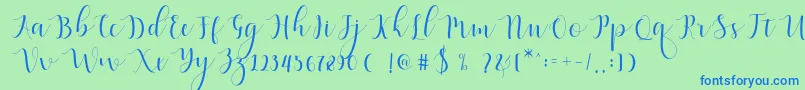 Qatielia Script-Schriftart – Blaue Schriften auf grünem Hintergrund