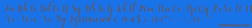 Qatielia Script-Schriftart – Braune Schriften auf blauem Hintergrund