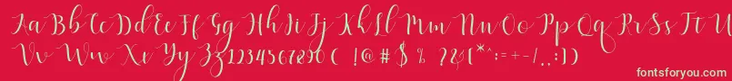 Fonte Qatielia Script – fontes verdes em um fundo vermelho