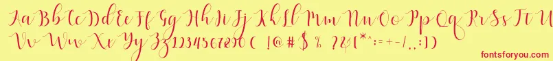 Qatielia Script-Schriftart – Rote Schriften auf gelbem Hintergrund