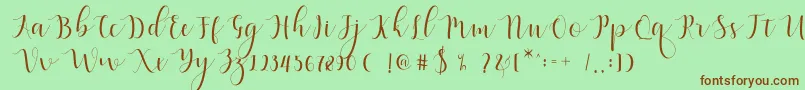 Qatielia Script Font – Brown Fonts on Green Background