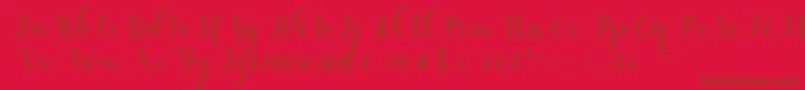 Qatielia Script-fontti – ruskeat fontit punaisella taustalla