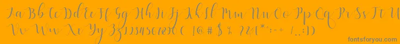 More about Qatielia Script Font Qatielia Script Font – Gray Fonts on Orange Background