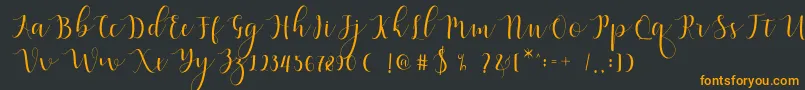 Fonte Qatielia Script – fontes laranjas em um fundo preto