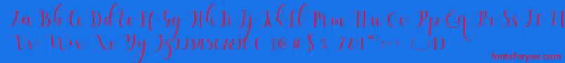 Qatielia Script Font – Red Fonts on Blue Background