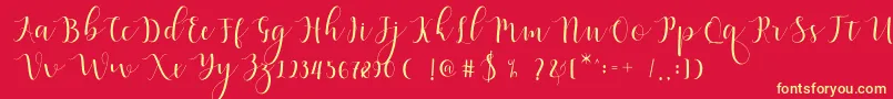 Fonte Qatielia Script – fontes amarelas em um fundo vermelho