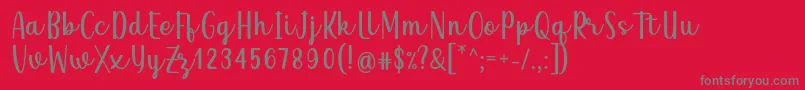 Czcionka Qeiza Font by Rifky 7NTypes – szare czcionki na czerwonym tle