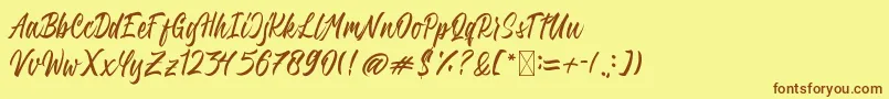 QimailaScript Font – Brown Fonts on Yellow Background