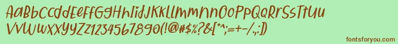 フォントQiyoshi Italic – 緑の背景に茶色のフォント