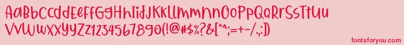 フォントQiyoshi Regular – ピンクの背景に赤い文字