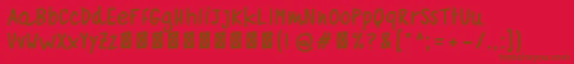 フォントquaderno bianco  bold – 赤い背景に茶色の文字