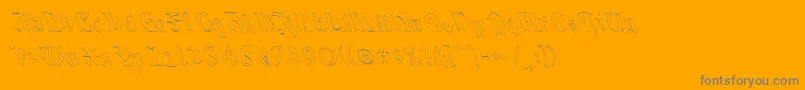 QuaelGothicHollowLeftyCondensed-fontti – harmaat kirjasimet oranssilla taustalla