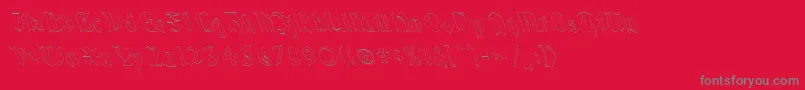 フォントQuaelGothicHollowLeftyCondensed – 赤い背景に灰色の文字