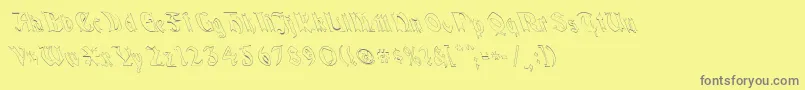 フォントQuaelGothicHollowLeftyCondensed – 黄色の背景に灰色の文字