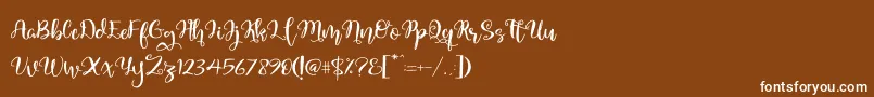 フォントQuaked – 茶色の背景に白い文字