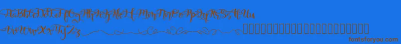 QuakedSwash-Schriftart – Braune Schriften auf blauem Hintergrund