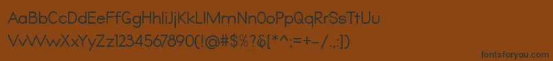 フォントQualio – 黒い文字が茶色の背景にあります