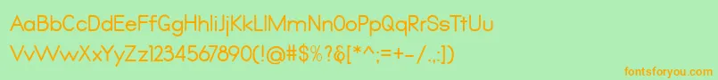 フォントQualio – オレンジの文字が緑の背景にあります。