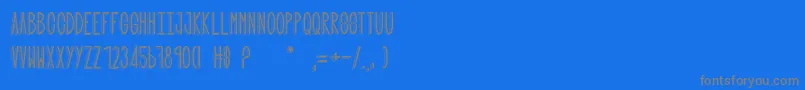 フォントQuand tu nes pas lР• – 青い背景に灰色の文字