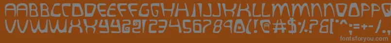 quatl Font – Gray Fonts on Brown Background