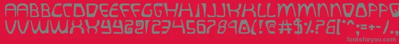 フォントquatl – 赤い背景に灰色の文字