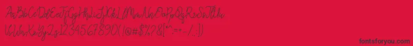 Queenesia-Schriftart – Schwarze Schriften auf rotem Hintergrund