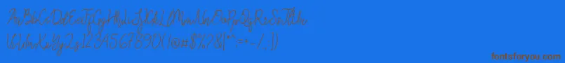 Queenesia Font – Brown Fonts on Blue Background
