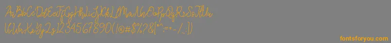 Queenesia Font – Orange Fonts on Gray Background