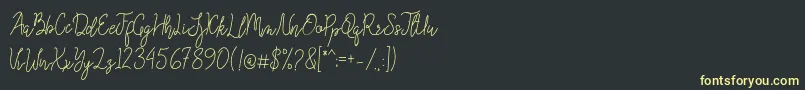 Queenesia Font – Yellow Fonts on Black Background