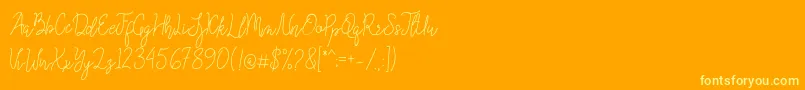 Queenesia Font – Yellow Fonts on Orange Background