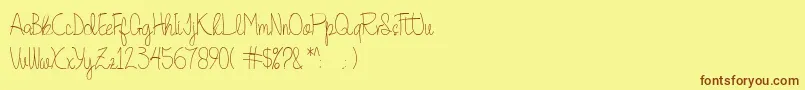 フォントQuesky – 茶色の文字が黄色の背景にあります。