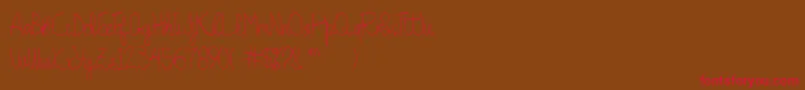 Quesky-Schriftart – Rote Schriften auf braunem Hintergrund
