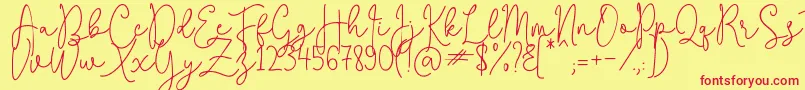 QuestaWhitte-Schriftart – Rote Schriften auf gelbem Hintergrund