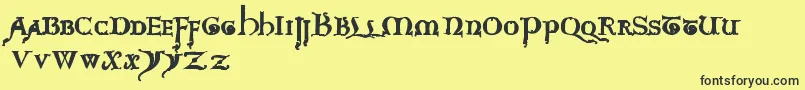 questra extra st-Schriftart – Schwarze Schriften auf gelbem Hintergrund
