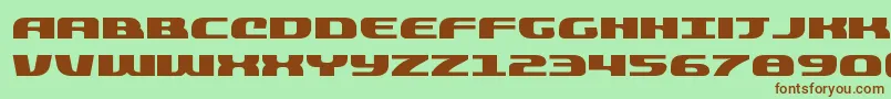 quickeningexpand-fontti – ruskeat fontit vihreällä taustalla