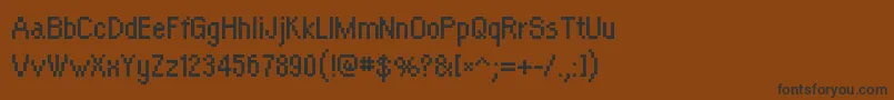 フォントOrangekidRegular – 黒い文字が茶色の背景にあります
