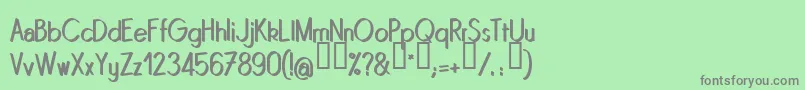 フォントQUINRG   – 緑の背景に灰色の文字