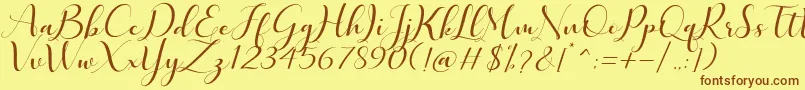 フォントQuintella – 茶色の文字が黄色の背景にあります。