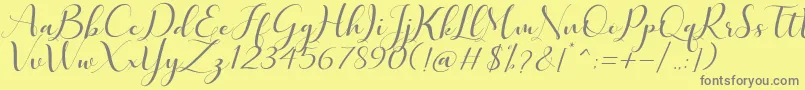 フォントQuintella – 黄色の背景に灰色の文字