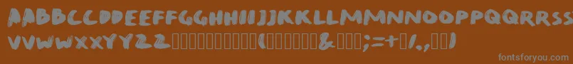 Шрифт QuirkBrushBig – серые шрифты на коричневом фоне