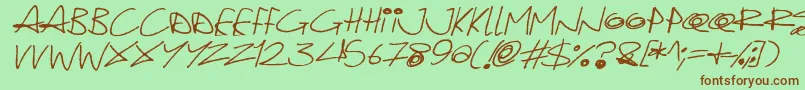 Fonte Quirky Cat Italic – fontes marrons em um fundo verde