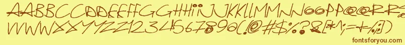 Fonte Quirky Cat Italic – fontes marrons em um fundo amarelo