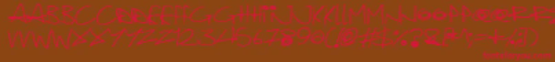 Quirky Cat-Schriftart – Rote Schriften auf braunem Hintergrund