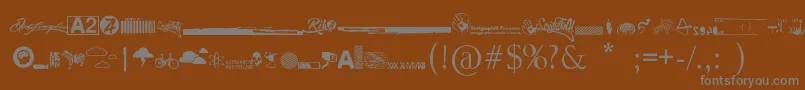 Шрифт R74 Dingbat attak – серые шрифты на коричневом фоне