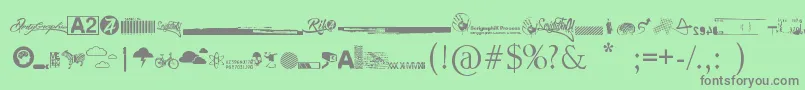 R74 Dingbat attak-fontti – harmaat kirjasimet vihreällä taustalla