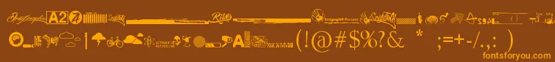 R74 Dingbat attak-fontti – oranssit fontit ruskealla taustalla