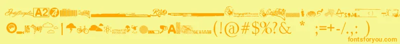 フォントR74 Dingbat attak – オレンジの文字が黄色の背景にあります。