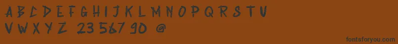 Rabsy Free Demo-Schriftart – Schwarze Schriften auf braunem Hintergrund